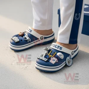 Indianapolis Colts NFL Crocs Crocband Clogs With Charms 8 Person wearing blue and white football themed clogs on a light surface.