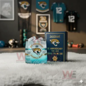 A close view of a teal Jacksonville Jaguars anniversary glass with ice standing next to a matching box in a decorated sports room!