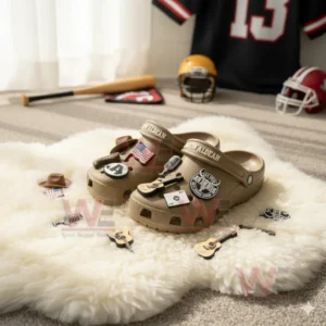 Jason Aldean Crocs Crocband Clogs With Charms 6 Brown clogs with country charms on a white rug in a sports themed room.