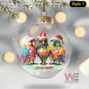 Clear ornament with three Santa hat parrots gathered around a tropical drink inside!