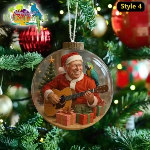 Jimmy Buffett Christmas Ornament 9 A Christmas ornament showing Santa Jimmy Buffett playing guitar, with a parrot and gifts, capturing the Margaritaville holiday vibe.