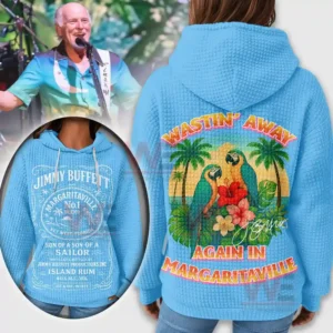 A blue textured hoodie with a large tropical bird illustration on the back and ornate white text on the front displayed beside a scene of a man performing!