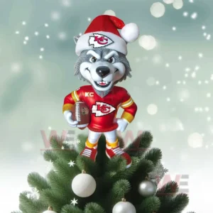 Wolf mascot in Kansas City Chiefs outfit with Santa hat holding football on Christmas tree.
