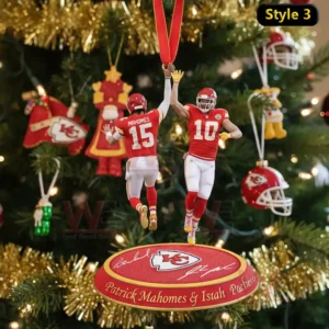 A Kansas City Chiefs-themed ornament with Patrick Mahomes and Isiah Pacheco celebrating with a high five, complete with festive details and team branding.