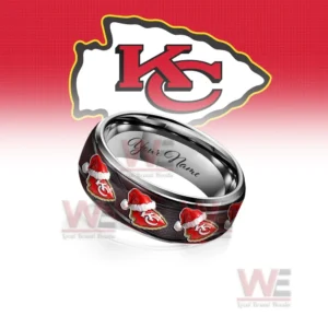 A dark ring decorated with festive shield motifs shown in front of a bold team emblem background!