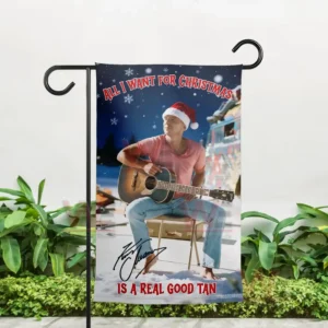 Kenny Chesney Christmas Garden Flag 5 Alt text: Outdoor display of a Christmas garden flag with Kenny Chesney in a Santa hat and holding a guitar.