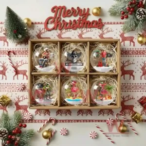 A holiday gift box presenting six detailed tropical and country themed globe ornaments in a festive layout!