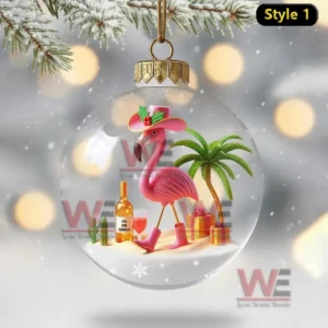 A tropical themed ornament with a pink flamingo and palm trees inside a clear holiday globe!