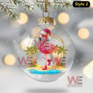 A beach themed ornament with a festive pink flamingo and palm trees inside a clear globe!