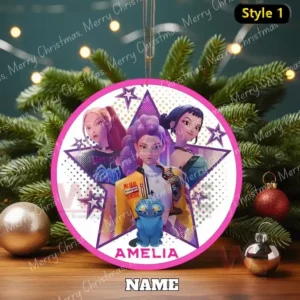 Round ornament with three animated Kpop style girls and a small blue creature displayed above the name Amelia on a decorated tree!