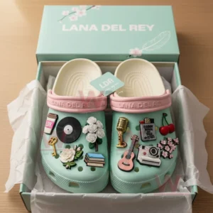 Lana Del Rey Crocs Crocband Clogs With Charms 7 A boxed pair of pastel green clogs decorated with music and floral themed charms!