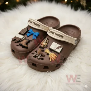 Brown charm decorated clogs displayed on a white rug!
