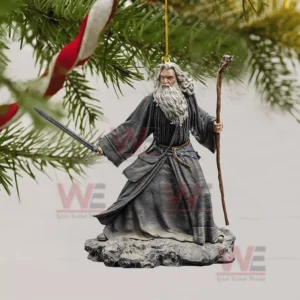 Lord of The Rings Christmas Tree Topper With Ornament 14 A wizard ornament holding a sword and staff hanging from a tree branch.