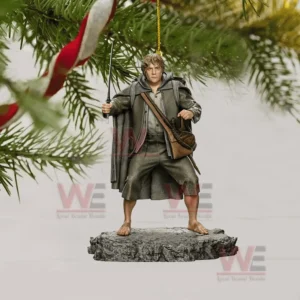 Lord of The Rings Christmas Tree Topper With Ornament 15 A hobbit ornament holding a sword hanging from a tree branch.