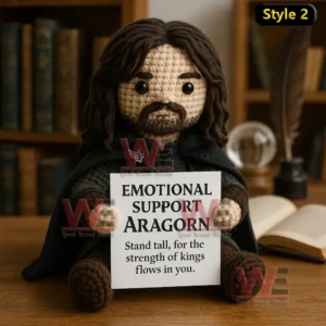 Lord of the Rings Emotional Support Doll 7 A crochet doll with long hair and a beard wearing a dark outfit holding a supportive message sign!