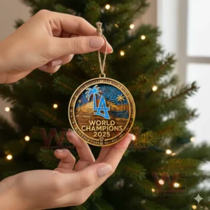 Los Angeles Dodgers 2025 World Champions Ornament 3 Hand holding Los Angeles Dodgers 2025 World Champions ornament near Christmas tree with lights in background!