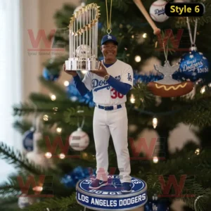 A Christmas ornament featuring a gold trophy baseball and Dodgers logo celebrating the 2025 World Series championship.