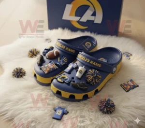Los Angeles Rams Crocs Clogs with Charms 6 Los Angeles Rams themed Crocs decorated with sports charms and displayed next to official team packaging box!