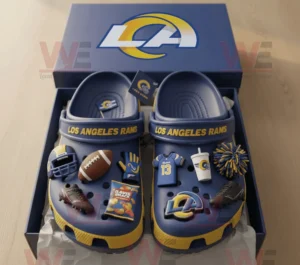 Los Angeles Rams Crocs Clogs with Charms 8 Los Angeles Rams themed Crocs with sports charms neatly placed inside team logo packaging box on wooden table!