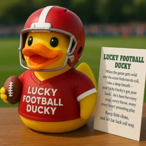 Yellow rubber duck in football gear holding ball next to Lucky Football Ducky sign on table!
