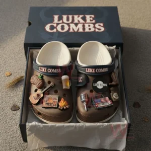 Alt text: Luke Combs-themed Crocs with country-themed charms inside a box.