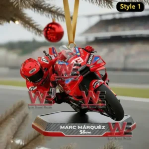 A Christmas ornament showing Marc Marquez racing on a Ducati motorcycle in a dynamic, action-packed pose.