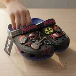 Megadeth Band Crocs Crocband Clogs With Charms 7 Alt text: Hand placing a charm on Megadeth-themed Crocs with metal-inspired charms.