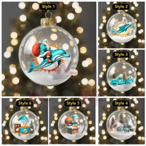 A glass ornament with Santa riding a dolphin and surrounded by snowy decoration!