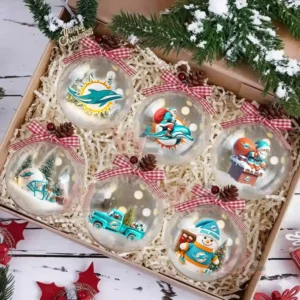 A glass ornament with the team logo set against miniature trees in snow!