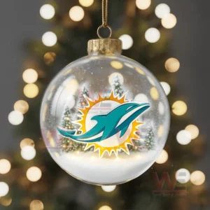A glass ornament with a team helmet football and snowy winter decorations!