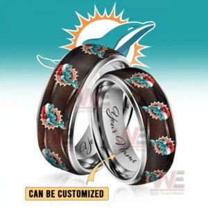 Two polished rings with dolphins symbols in festive hats shown in front of a large team logo background!
