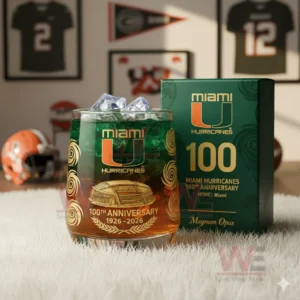 Miami Hurricanes 1926-2026 100th Anniversary Whiskey Glass 4 A clear view of a Miami Hurricanes anniversary glass with ice standing next to its themed box in a well lit room with team decor!