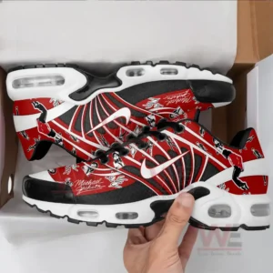A top-down view of Michael Jackson-themed sneakers with red and black graphics.