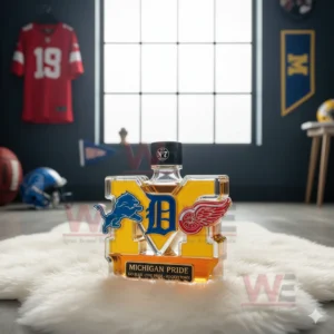 A Michigan Pride bottle with a black cap sits on a white rug in a dark themed sports room!