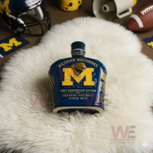 Michigan Wolverines bottle on white rug with sports accessories around it!
