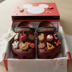 Red clogs embellished with colorful themed charms presented inside an open red box!
