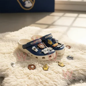 Alt text: Milwaukee Brewers-themed Crocs with baseball-related charms on a fluffy white rug.