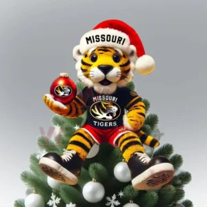 Tiger mascot in Missouri shirt and Santa hat sitting on Christmas tree holding red ornament!