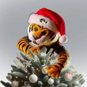 Tiger mascot in Santa hat climbing decorated Christmas tree with white ornaments!