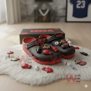 Black and red MMA charm decorated clogs displayed on a white rug!