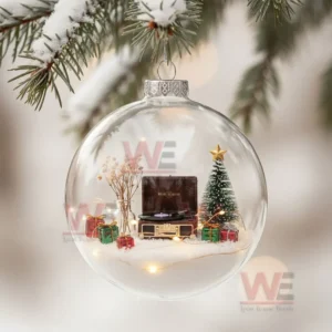 Clear ornament with miniature record player tree and gifts hanging on a snowy branch!