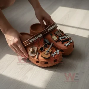 Morgan Wallen Crocs with Charms 8 Close up of Morgan Wallen Crocs being arranged on the floor emphasizing country music inspired charms and rustic design!