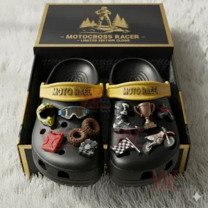 MotoCross Racer Crocs Crocband Clogs 4 Black motocross charm clogs shown in an open box on a white fluffy rug.