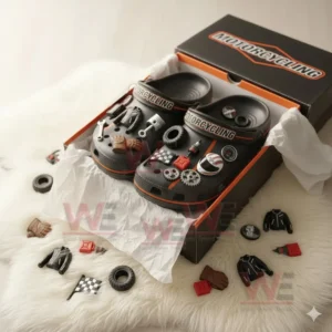 Motorcycle themed clogs in an open box with assorted mechanical and racing charms nearby.!