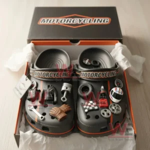 A boxed pair of motorcycle themed clogs covered with detailed racing and mechanical charms.!
