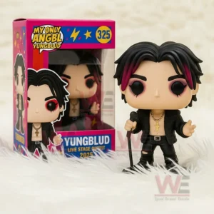 Vinyl figure of a singer with black and red hair holding a microphone beside a colorful display box.