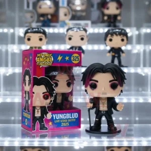 My Only Angel Yungblud Pop Vinyl Figures 4 Vinyl singer figure with matching box displayed on a lit shelf among other collectible figures.