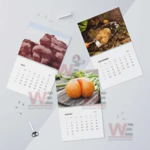 Natures Butt 2026 Wall Calendar 9 Calendar sheets for July August and September featuring a rock formation a potato in soil and an orange vegetable displayed on a flat surface!