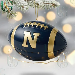 Navy Midshipmen Christmas Tree Topper With Ornament 16 Navy Midshipmen football ornament with gold N logo hanging from snow-covered tree branch.