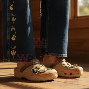 Neil Young Crocs worn with embroidered denim in a cozy wooden interior highlighting a folk country aesthetic!